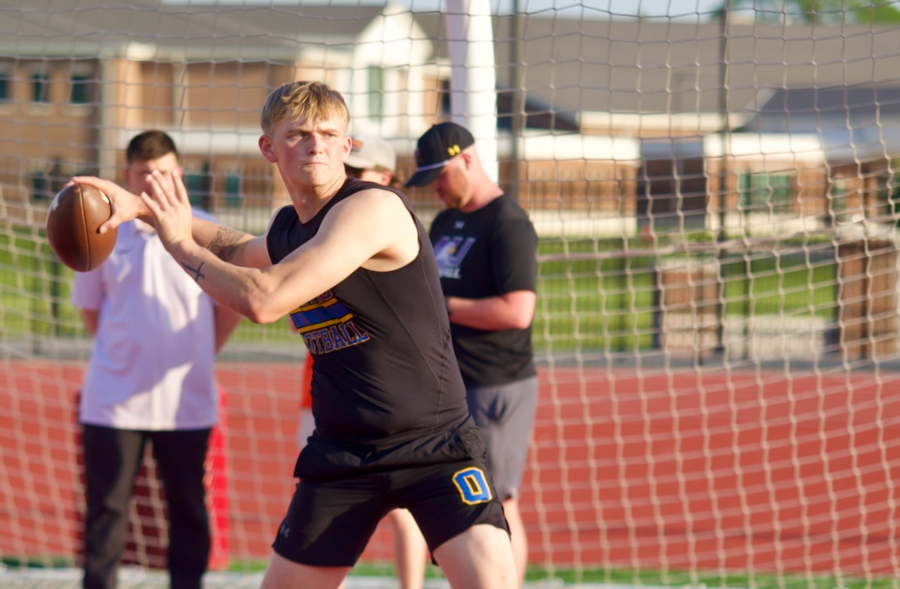 a quarterback throws a pass