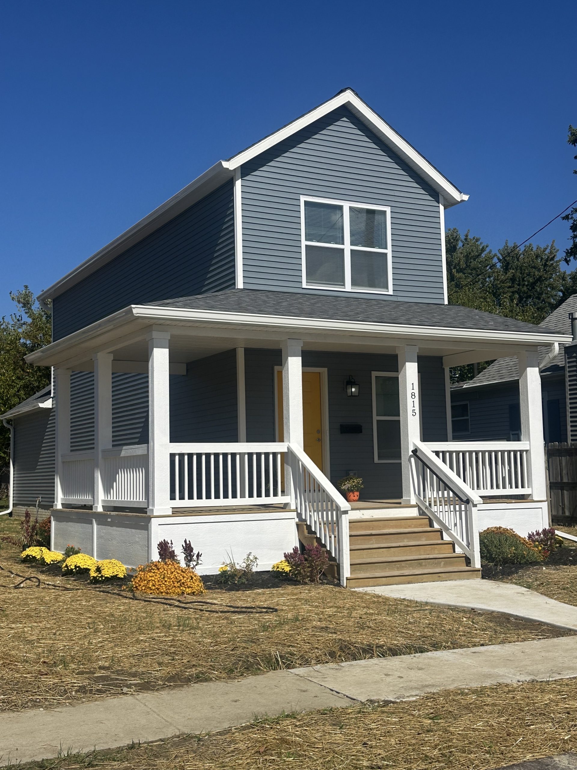 a two story house with a front porch