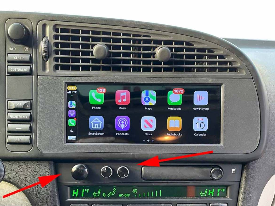 Saab 9-3 pre-facelift dashboard with ICM4 touchscreen and newly added OEM-style physical volume and tone knobs integrated below the screen