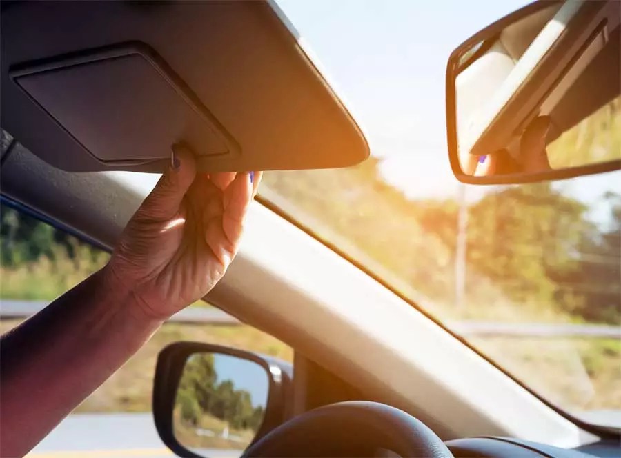 Fold the sheet and place it behind the driver's side sun visor