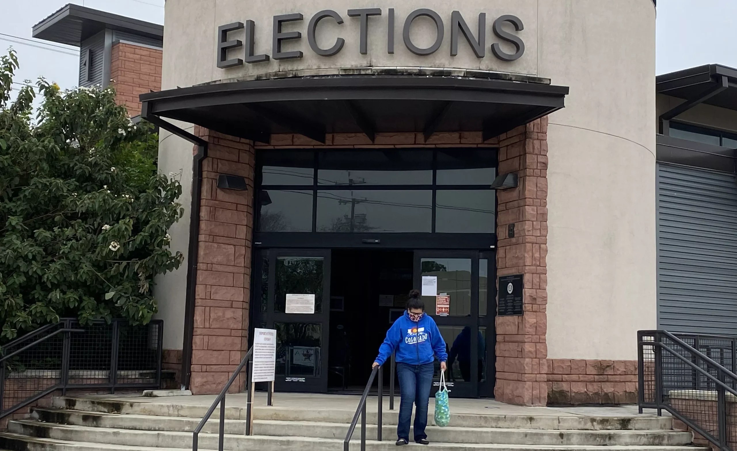 A voter leaves the Bexar County Elections Department office.