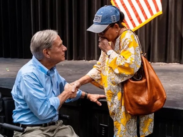 Critics trash Gov. Greg Abbott over photo showing him handing out checks from Texas flood benefit concert