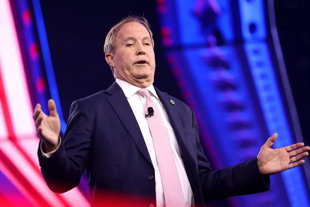 Texas Attorney General Ken Paxton speaking with attendees at the 2024 AmericaFest at the Phoenix Convention Center in Phoenix, Arizona.