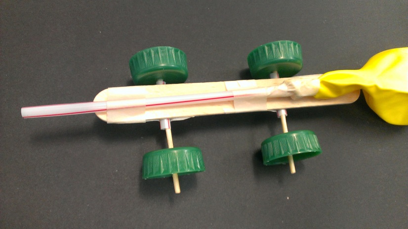 Find a hard surface, like a long table, linoleum floor, or sidewalk. Balloon Powered Car Science World