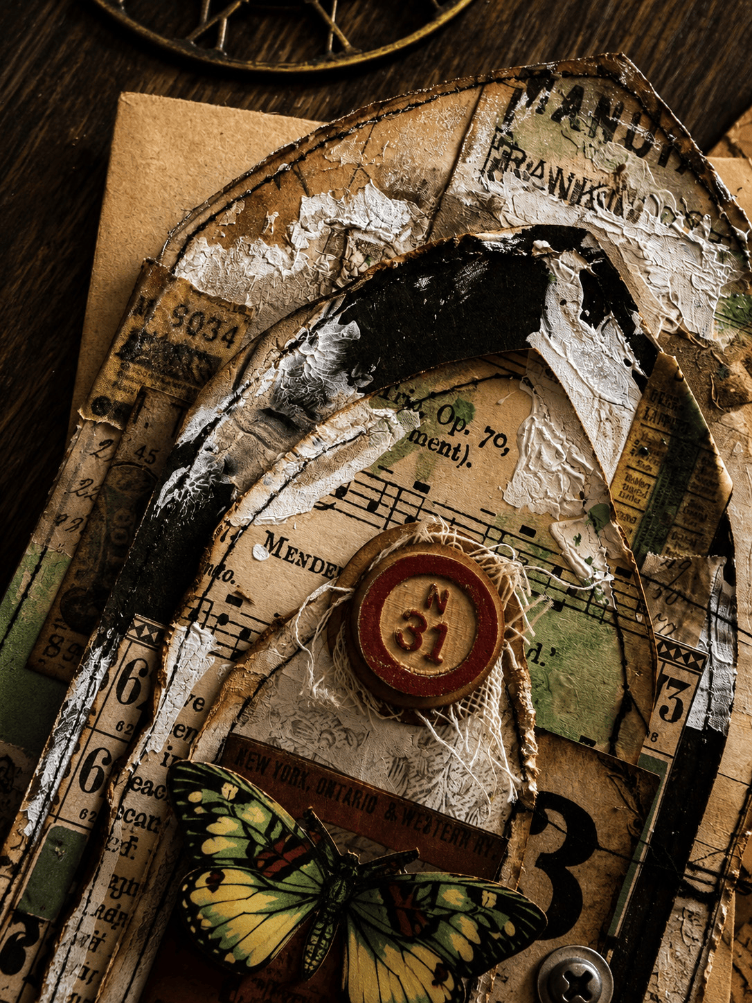 crackle paste and stitched paper layers on mixed media arch