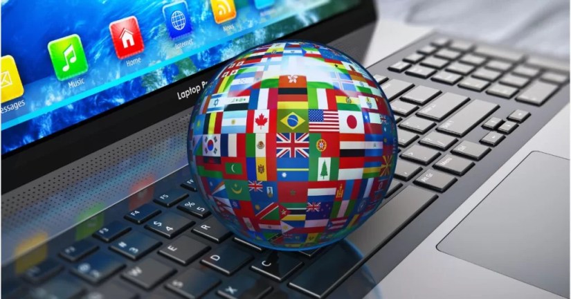 a globe with flags on it on a keyboard, representing professional translation