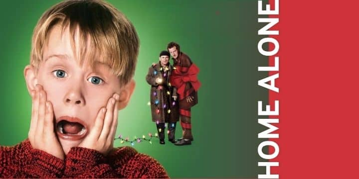 Young boy with hands on his cheeks looking surprised; two people in winter coats stand in the background; 'HOME ALONE' text on the red edge.