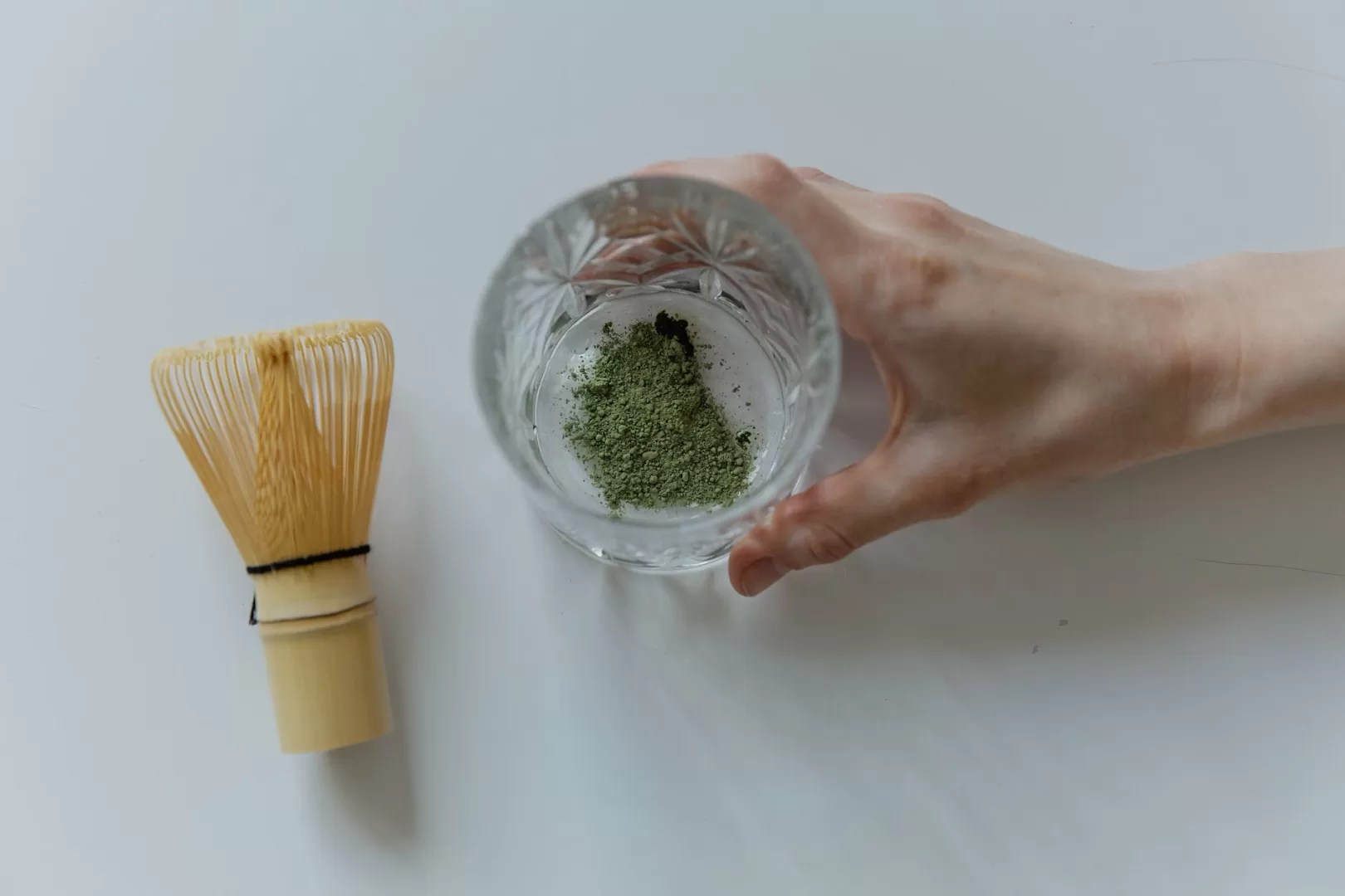 top view photo of matcha powder on clear glass