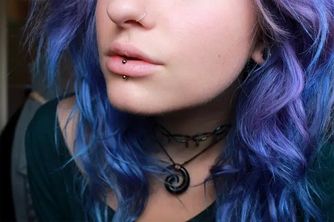 A vertical labret (luh·bret) piercing is a less popular lip piercing but it gives you a unique look. 13 Most Amazing Lip Piercing Jewelry Pictures - SheIdeas