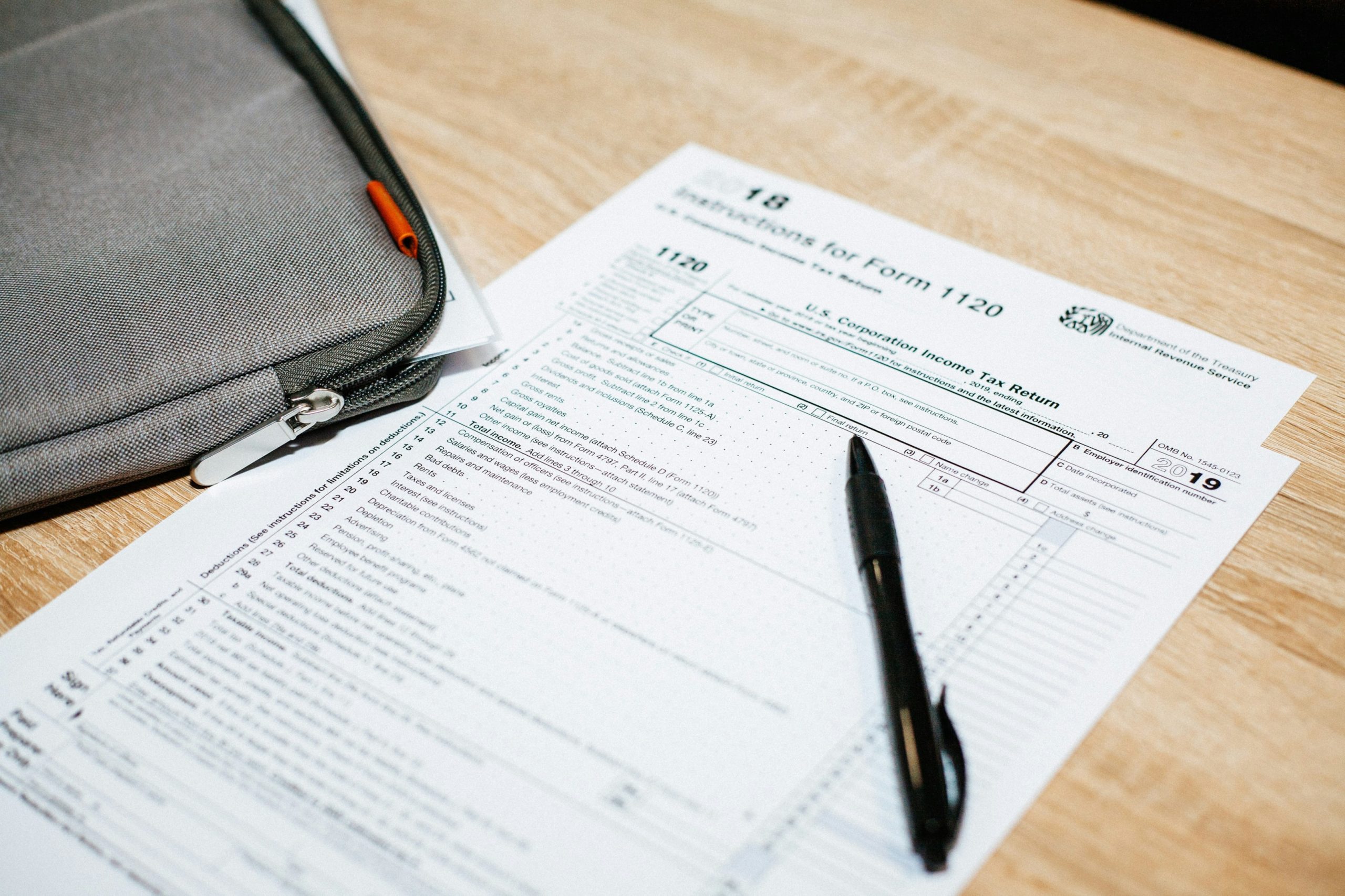 Forms on table with pen