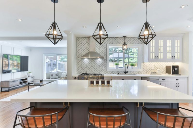 Bar stools at island in kitchen of Airbnb property