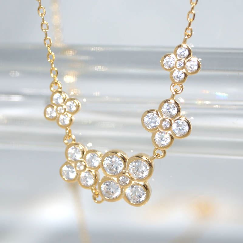 RI01082þSAUTOIR FLEUR DORE ZIRC