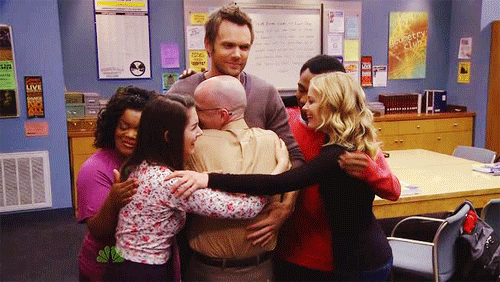 a group of people hugging and showing support