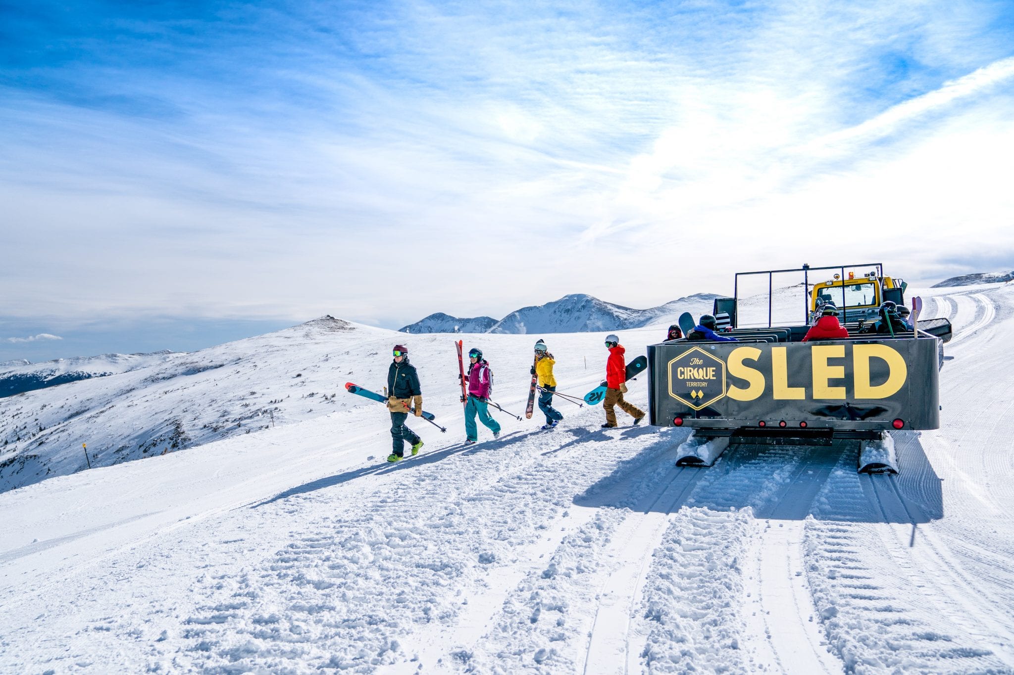 Jump on the Cirque Sled snowcat for easier access to the powder.