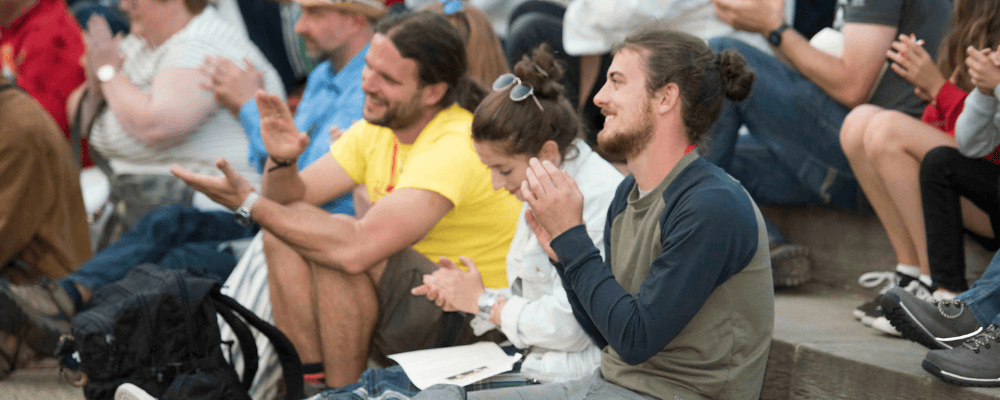 Close up of SO Festival audience members clapping