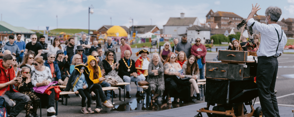 Quacksalver entertaining the audience at Mablethorpe with a puppet show