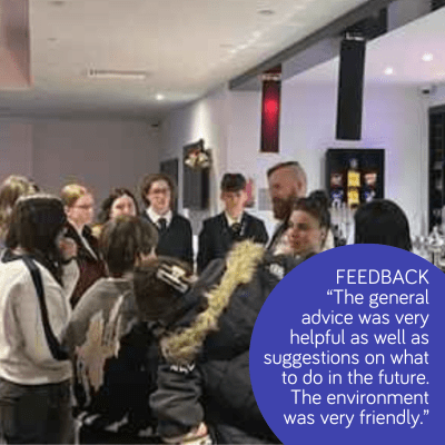 meet up of creatives having a chat- with feedback text of advice being helpful