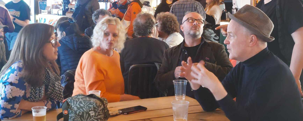 4 people sat at a table networking at the creative meetup in skegness