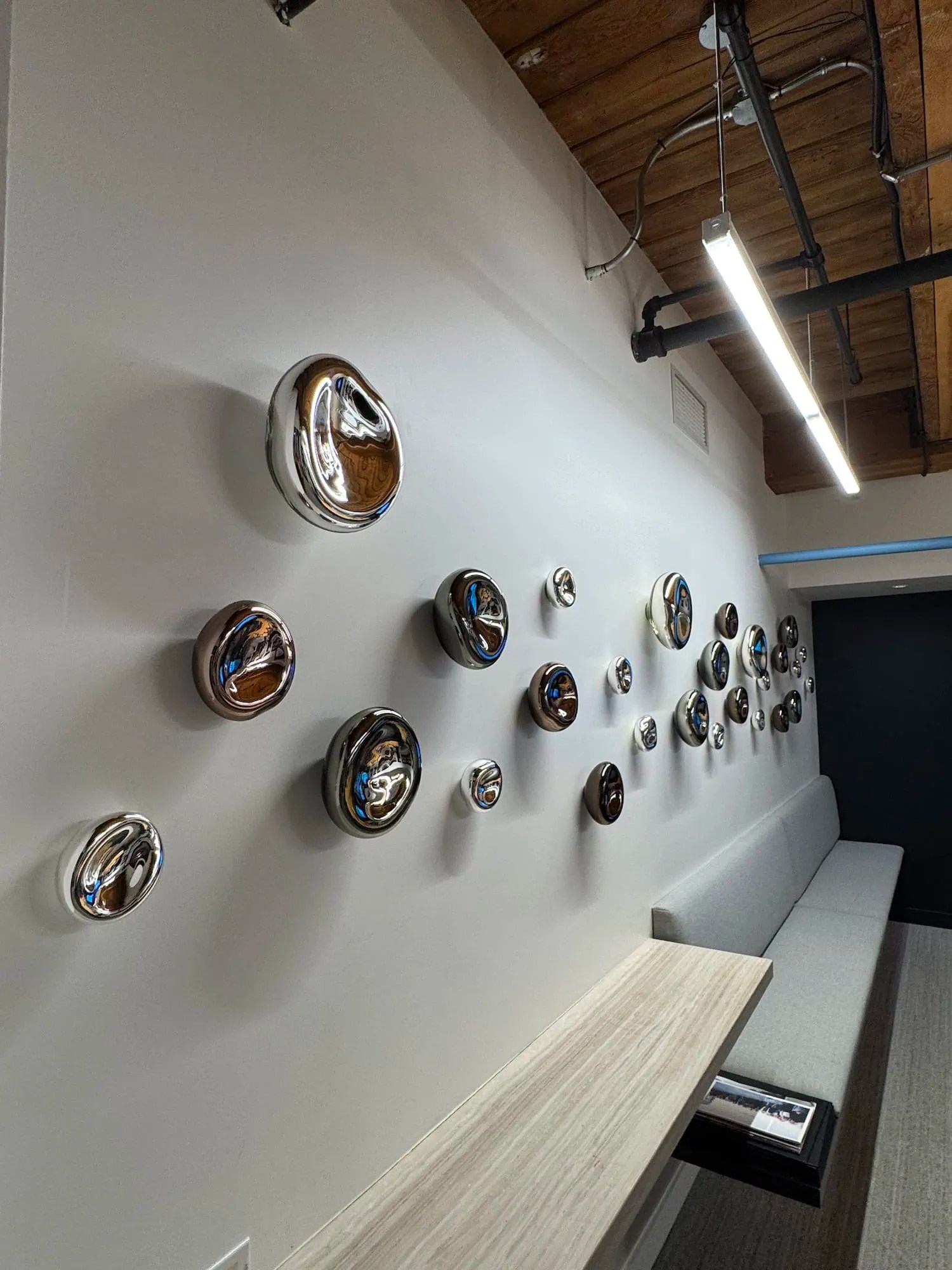 Perspective view along Wall Cells installation showing scale variation from large to small forms, SGH Design Partners Toronto office