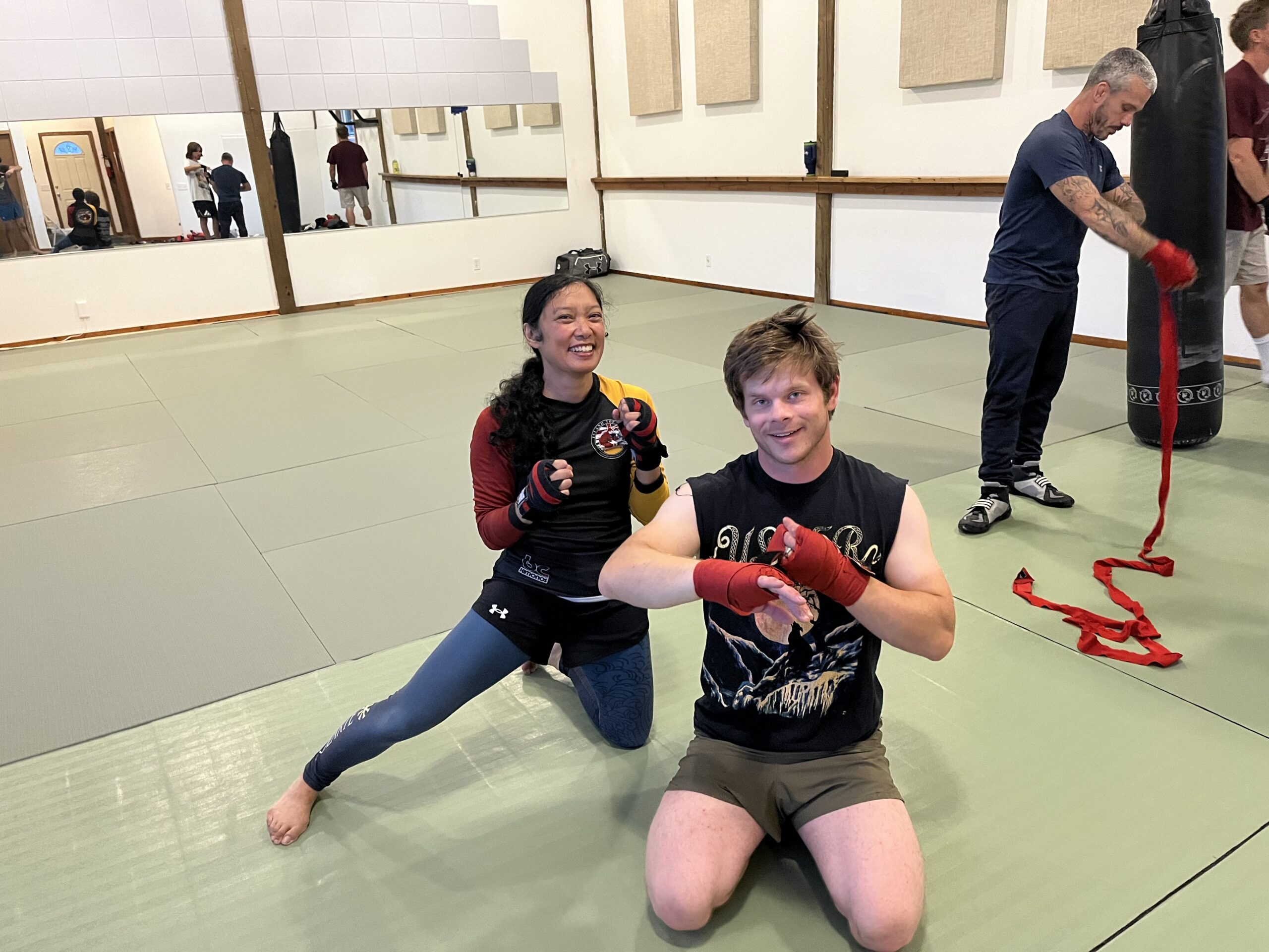 jenn and adam putting on boxing hand wraps