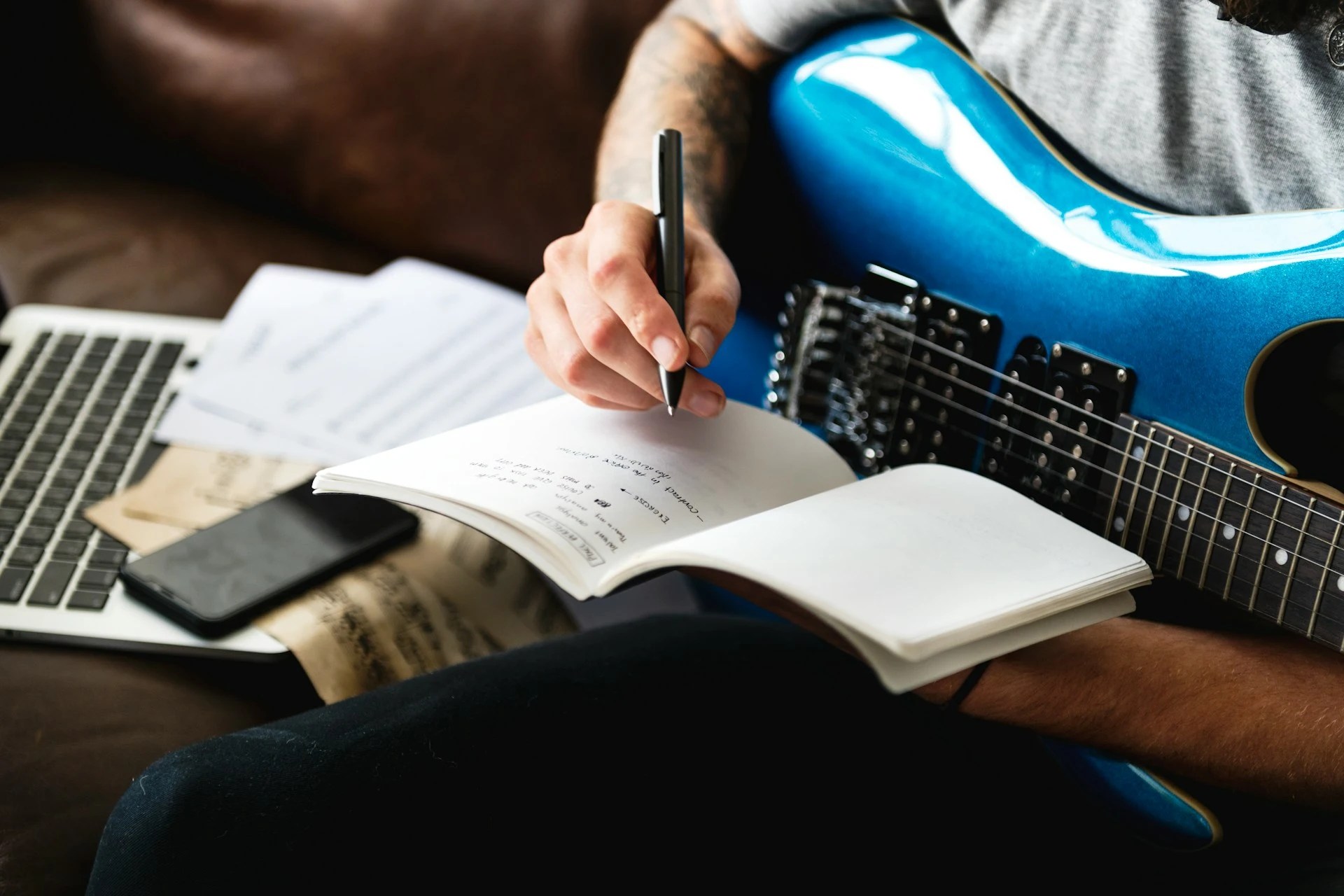 Song writing. A songwriter, writing a song.