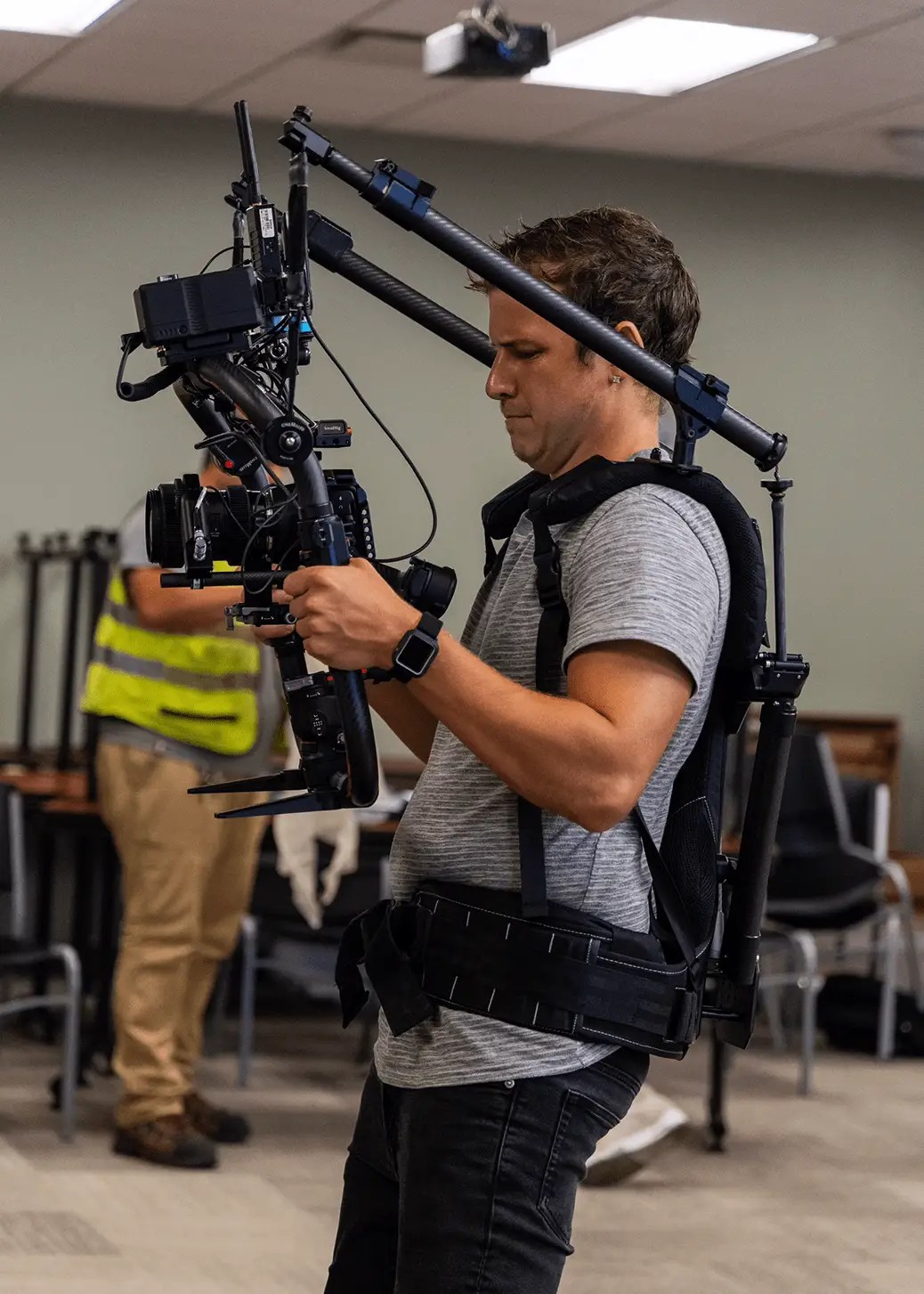 A male camera operator.