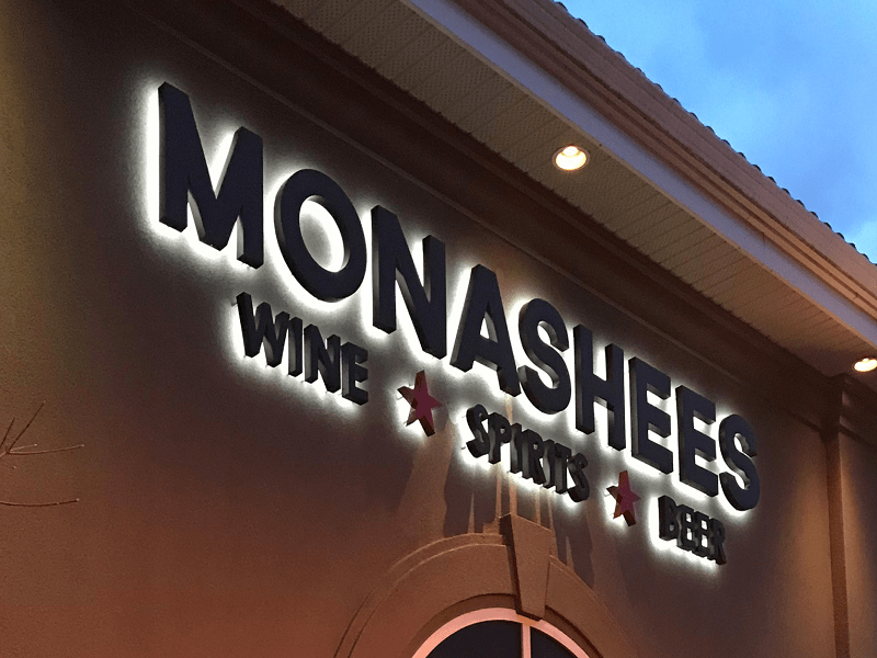 Backlit dimensional letters on Monashees's exterior sign.