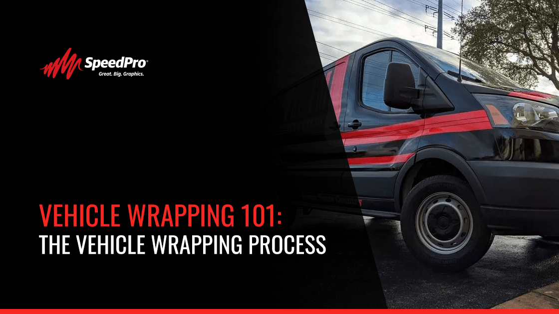 Automotive exterior showcasing black and red van with white text