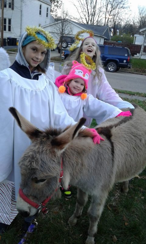 Three angels with their donkey