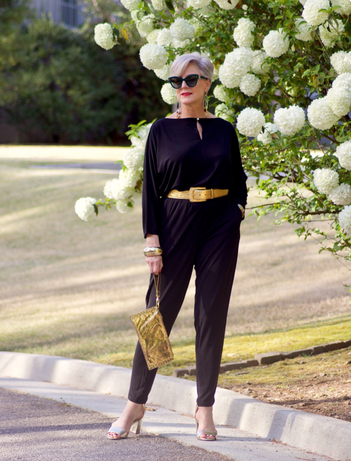 Black jumpsuit with gold accessories Clearance
