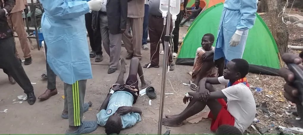 One of the infected patients taking his medication is lying on the floor (dust) as the facility ward is filled up. [Photo: Sudan Post]