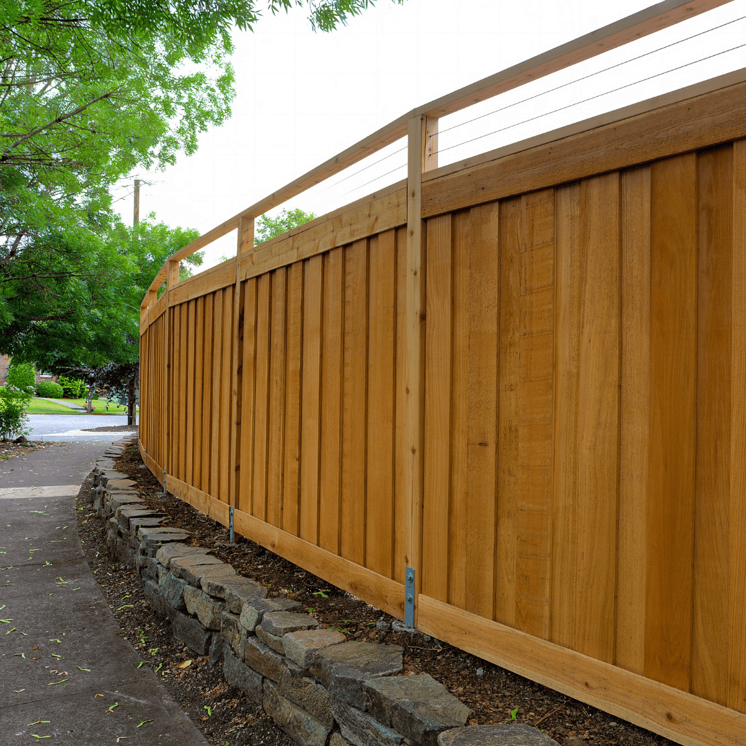 Professional fence contractor installing wood and vinyl fencing in Portland, Oregon