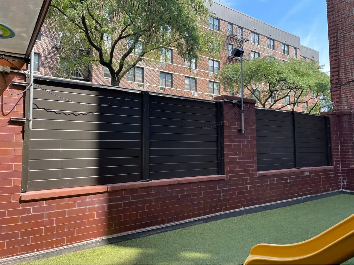 Professional fence contractor installing wood and vinyl fencing in Portland, Oregon
