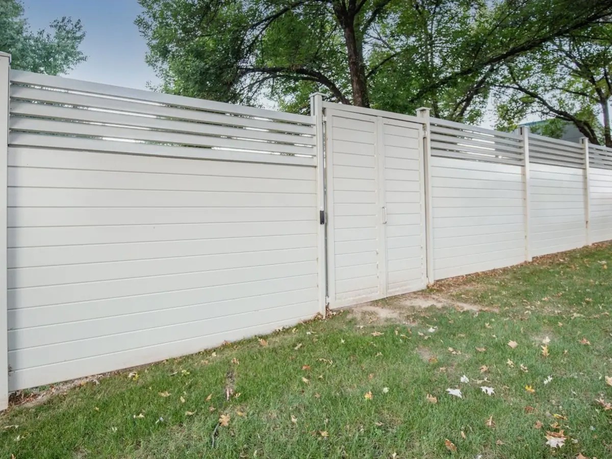 Professional fence contractor installing wood and vinyl fencing in Portland, Oregon