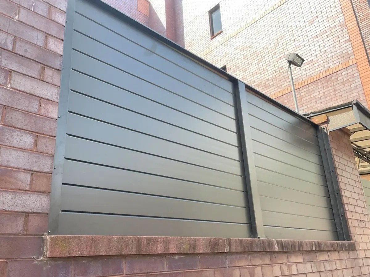 Professional fence contractor installing wood and vinyl fencing in Portland, Oregon