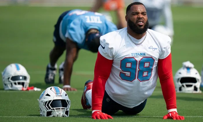 Jefferey Simmons stretching during training camp