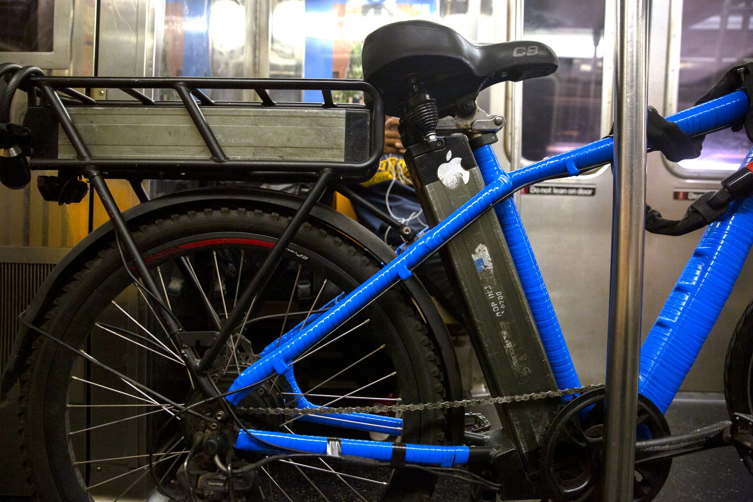 An e-bike rider had an extra battery stored on their cycle.