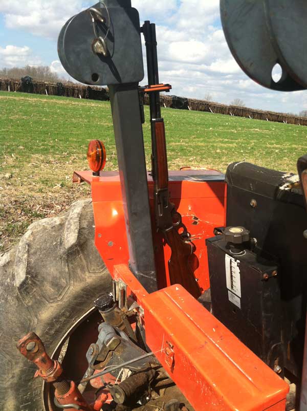 Military Grade Steel Gun Rack with Rubber Gun Butt mounted on farm tractor
