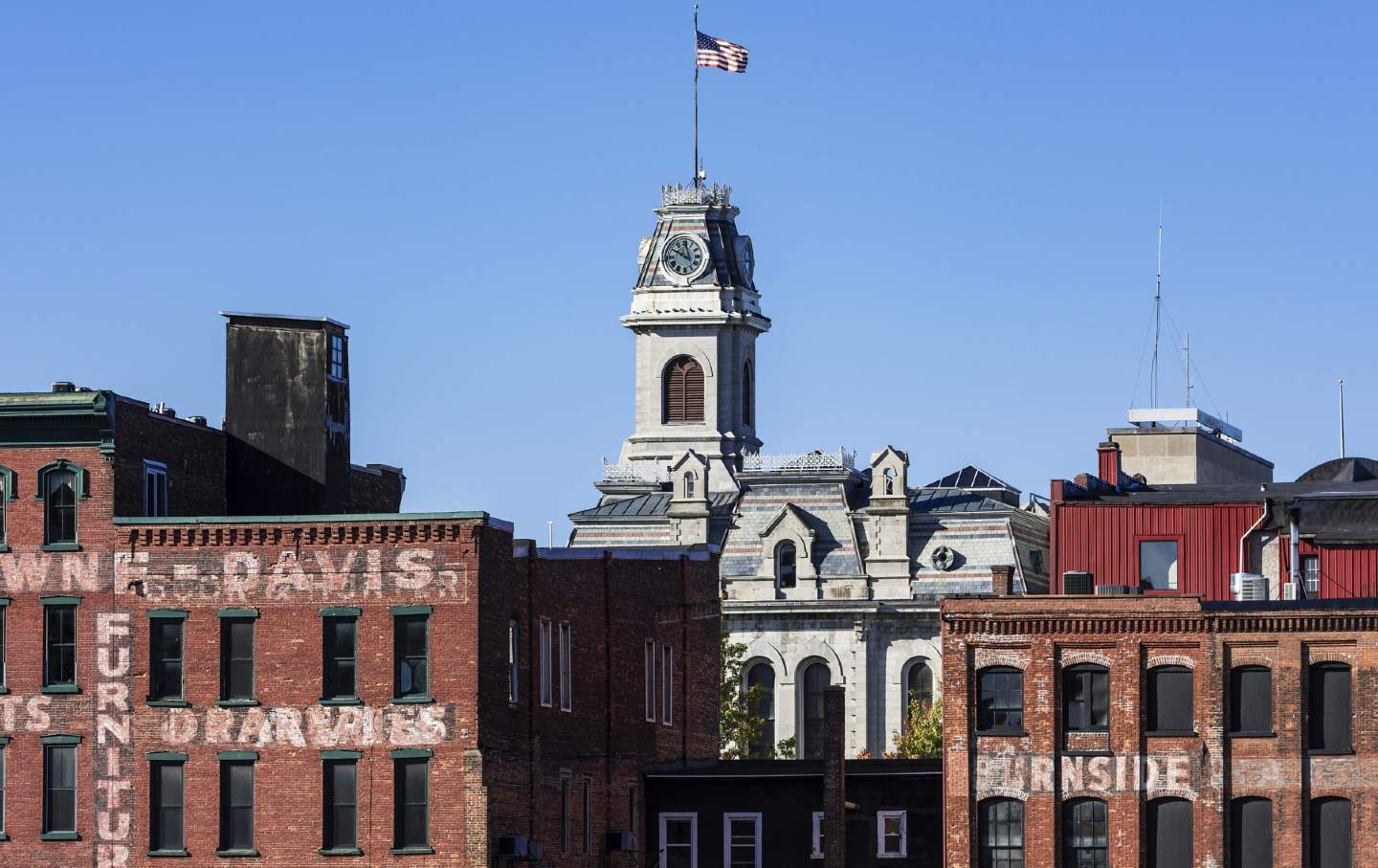 The City Hall clock tower and surrounding buildings in Oswego, New York, part of New York’s 24th Congressional District.
