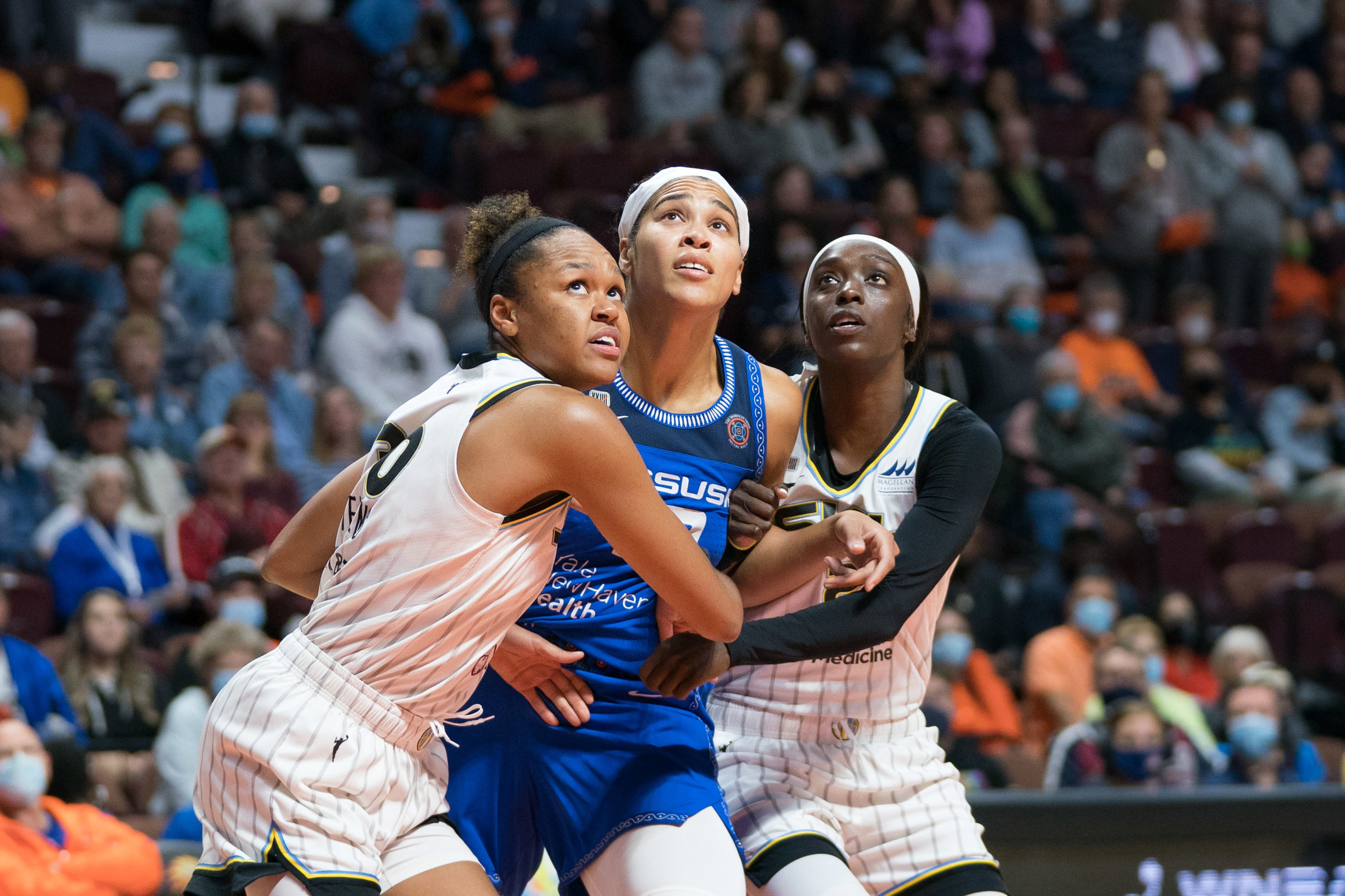 Chicago Sky forward Azurá Stevens (30) Connecticut Sun forward Brionna Jones (42) and Chicago Sky guard Kahleah Copper (2) fight for rebound position during the WNBA Semifinals game between the Chicago Sky and the Connecticut Sun at Mohegan Sun Arena, Uncasville, Connecticut, USA on September 30, 2021. Photo Credit: Chris Poss