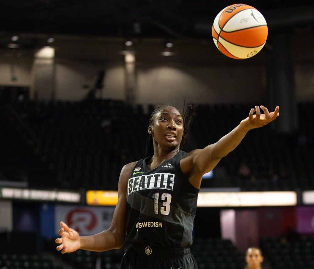 The ball is in midair a split second after Ezi Magbegor released a scoop layup