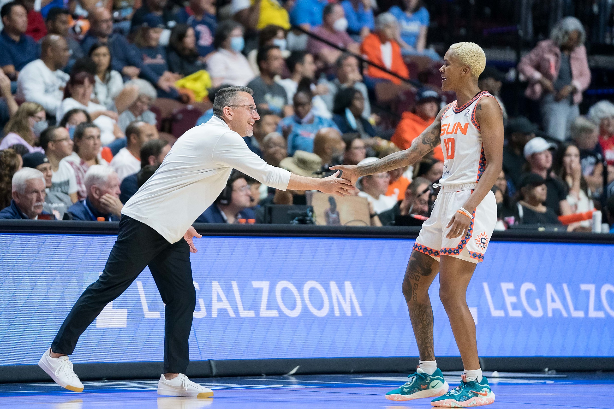Connecticut Sun Head Coach Curt Miller congratulates Connecticut Sun guard Courtney Williams (10) during the WNBA Semi-final game between the Chicago Sky and the Connecticut Sun at Mohegan Sun Arena, Uncasville, Connecticut, USA on September 06, 2022. Photo Credit: Chris Poss