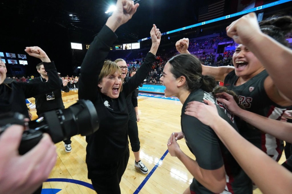 Kamie Ethridge celebrates with her players after knocking No. 3 ranked Utah out of the Pac-12 Tournament on Thursday, March 2, 2023. Photo Credit: Powers Imagery