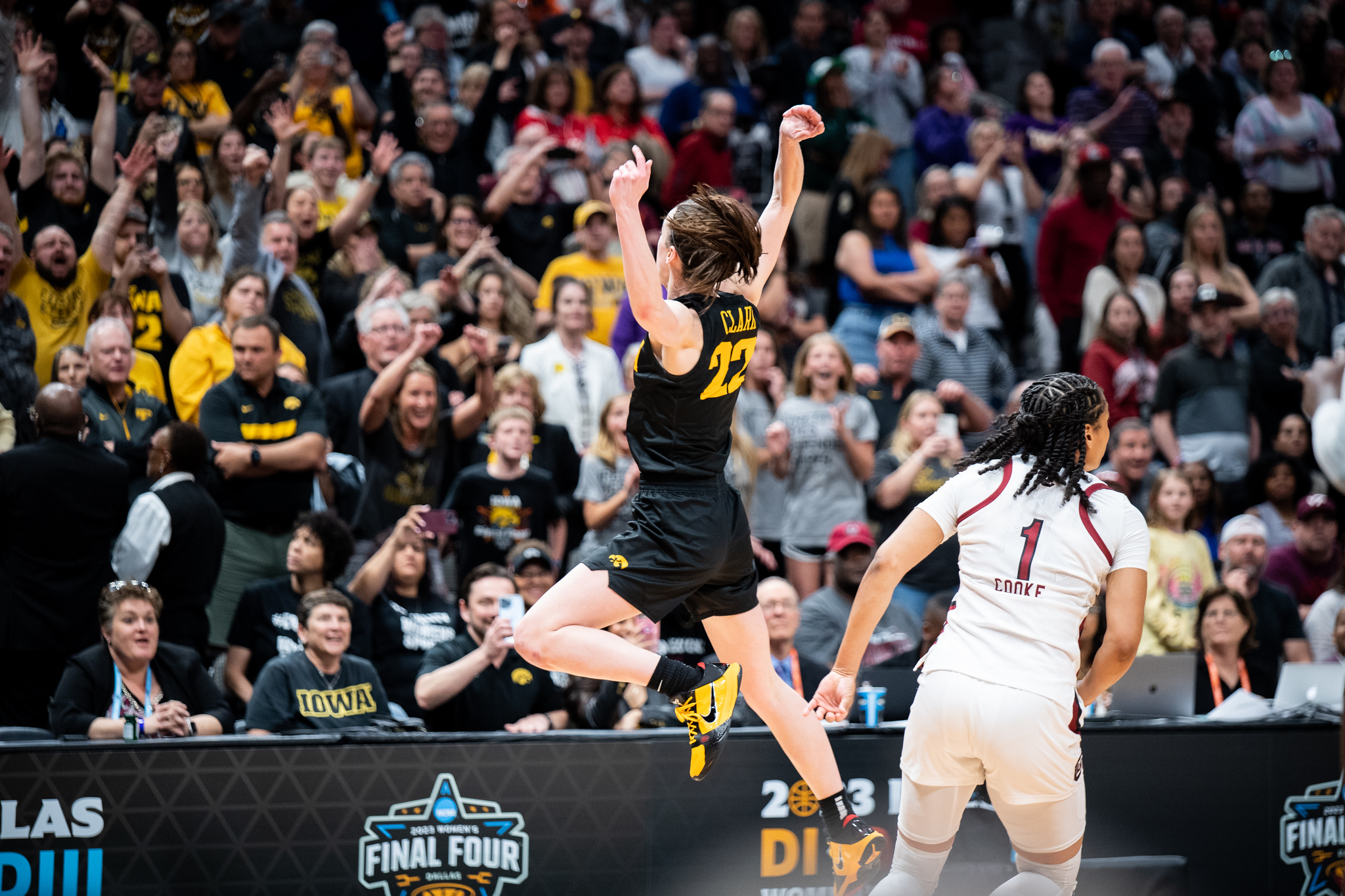 Caitlin Clark runs to the Iowa fan section after the Hawkeyes' victory over South Carolina on March 31, 2023 in Dallas, Texas. (Photo credit: Domenic Allegra)