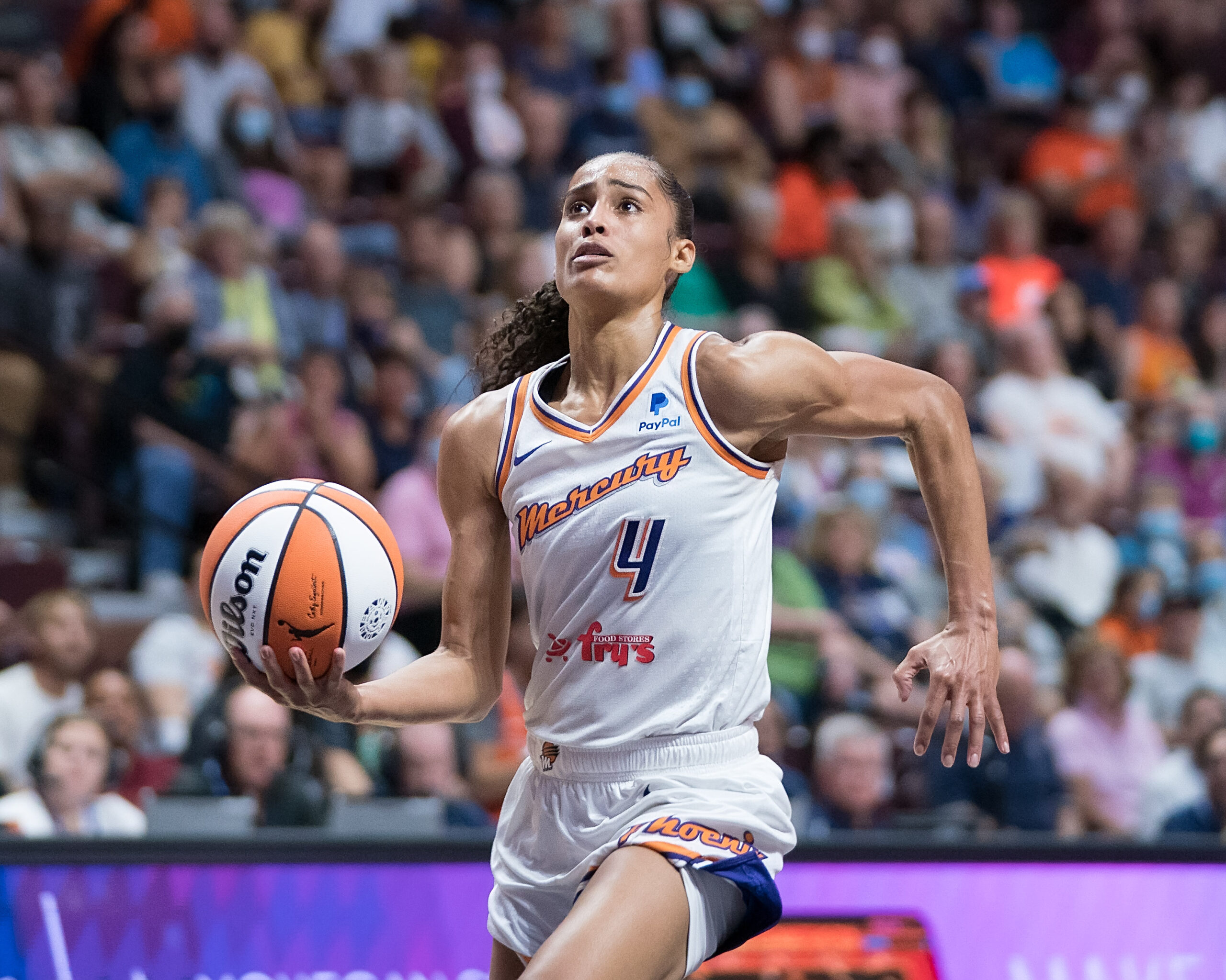 Phoenix Mercury guard Skylar Diggins-Smith prepares to jump in the air for a right-handed layup.