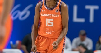 Connecticut Sun guard Tiffany Hayes yells and clenches her fists in celebration.