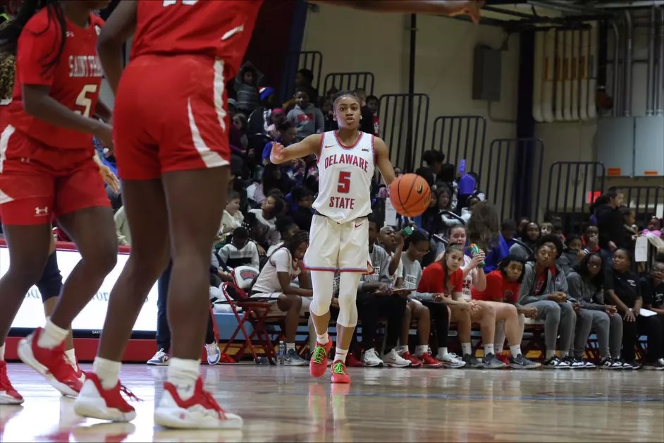 Delaware State's Kiarra Mcelrath brings the ball up the floor against saint Francis during a game earlier this season. (Photo credit: Delaware State Athletics Communications)