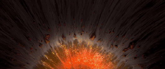 A gif from a video showing abstract moving forms of colorful ink and glitter.