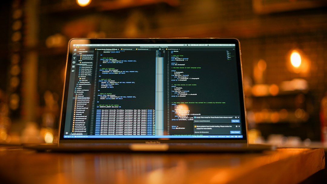 Laptop with code on screen in a coffee shop, representing learning Core Java and Advanced Java