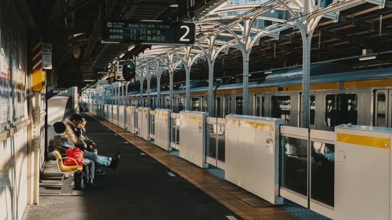 passengers waiting at tokyo train station platform